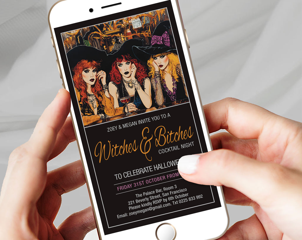 A close-up of a person holding a smartphone with a white phone case, displaying a Halloween-themed invitation design with three witch illustrations and gold script text on a black background.