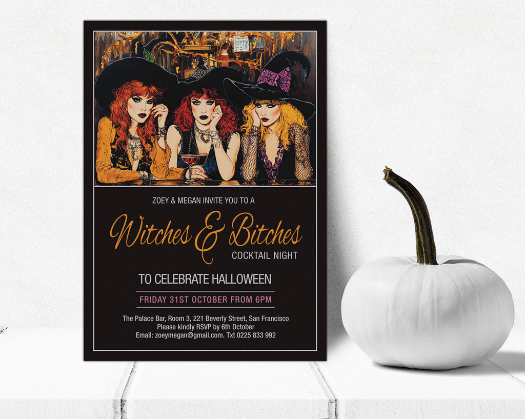 A Halloween-themed invitation card styled on a white wooden surface next to a white decorative pumpkin. The invitation features an illustration of three witches with black hats and gold lettering that reads 'Witches & Bitches Cocktail Night'.