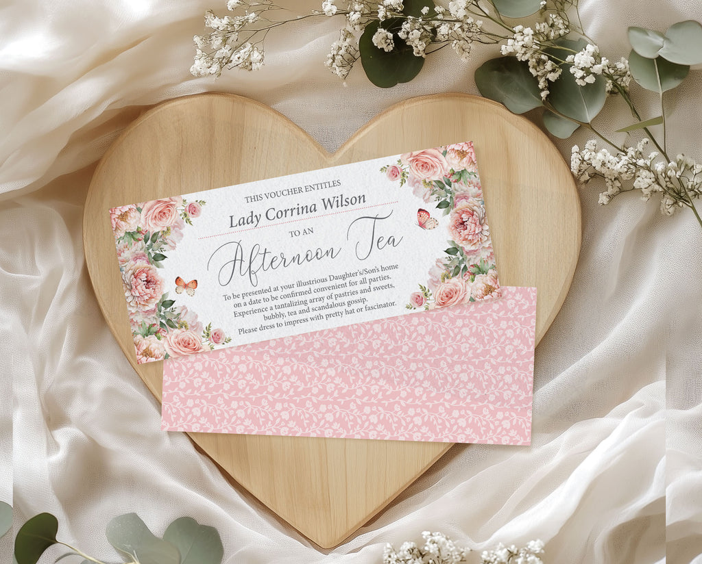Gift voucher with floral design on a heart-shaped wooden board surrounded by flowers.