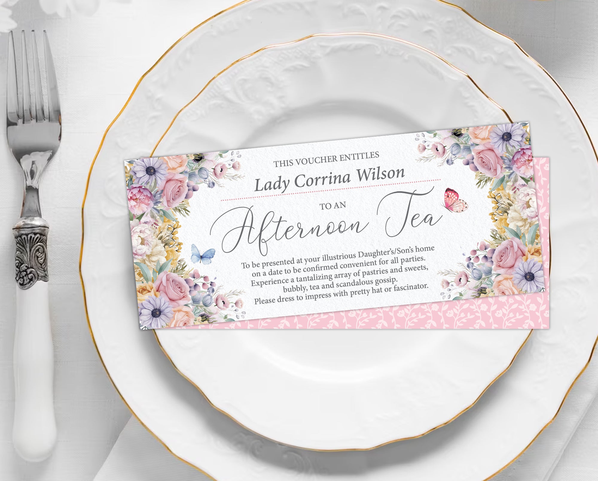 front and back of a pastel Floral voucher on a white plate with silverware