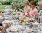 Pretty tea party table with people